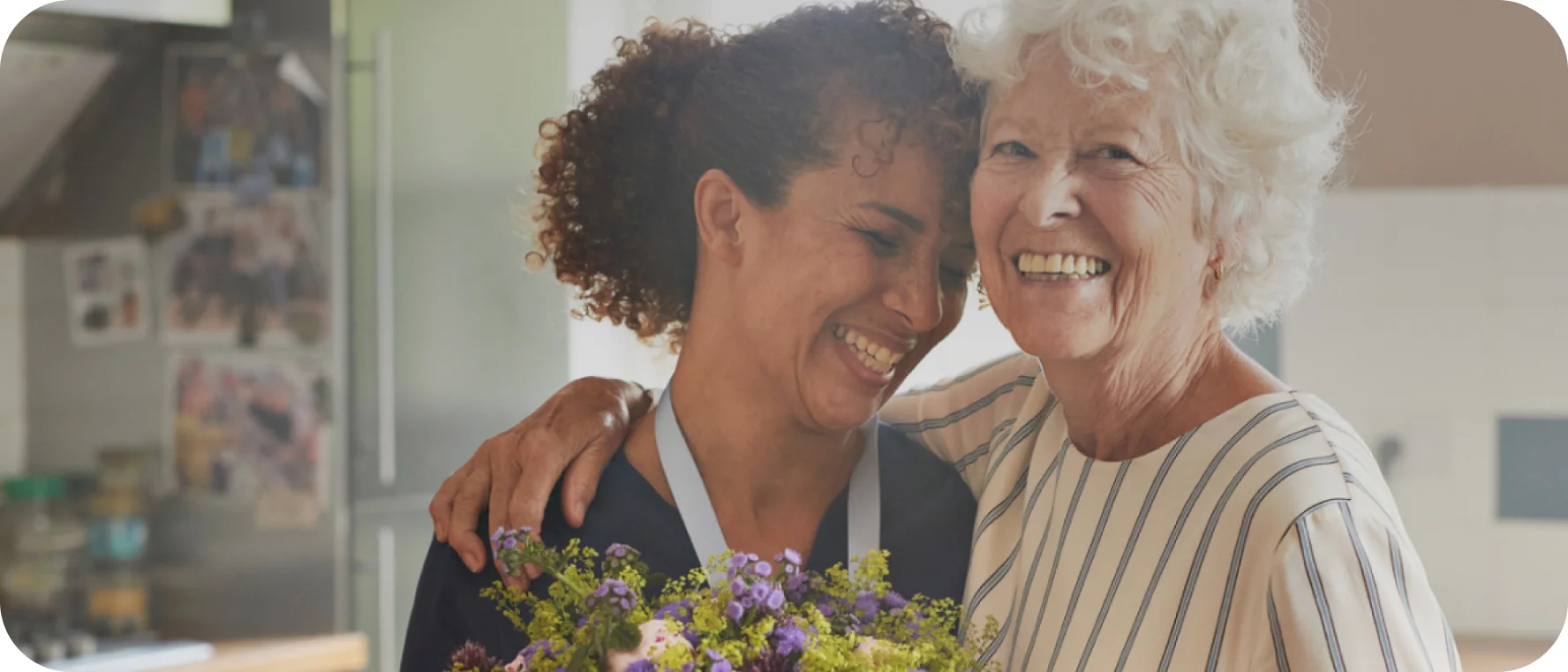 Two women smile at each other